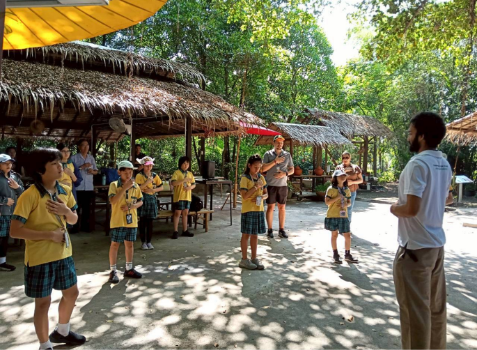 Students being introduced to the community forest